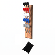 Wooden dart rack holding darts with black, red, white, blue, and gray flights