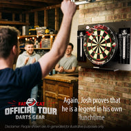 Man celebrating a throw at the dartboard set on a brick garage wall as two friends applaud