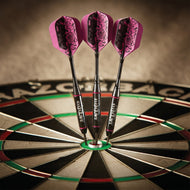 Three Dart Bitch darts grouped in a bristle dartboard with pink rose flights