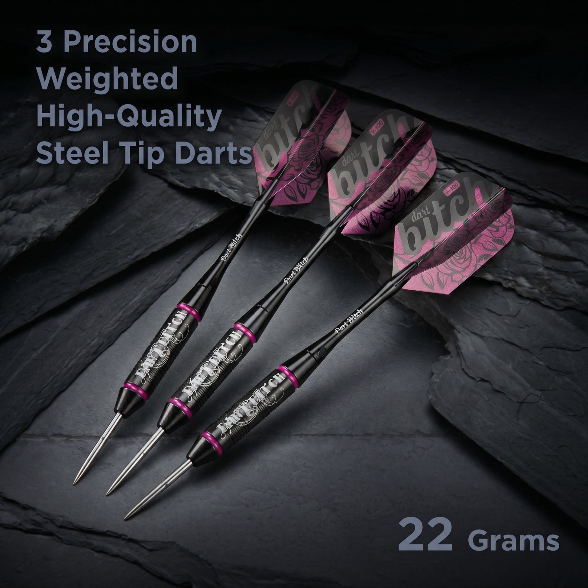 Three Dart Bitch darts on dark slate with black barrels and rose flights, 22 Grams badge