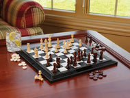 Chess set with light and dark wood pieces on black leather board with checkers nearby