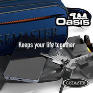 Blue Nomad Oasis dart case beside a phone, keys and a black Nomad hard dart case