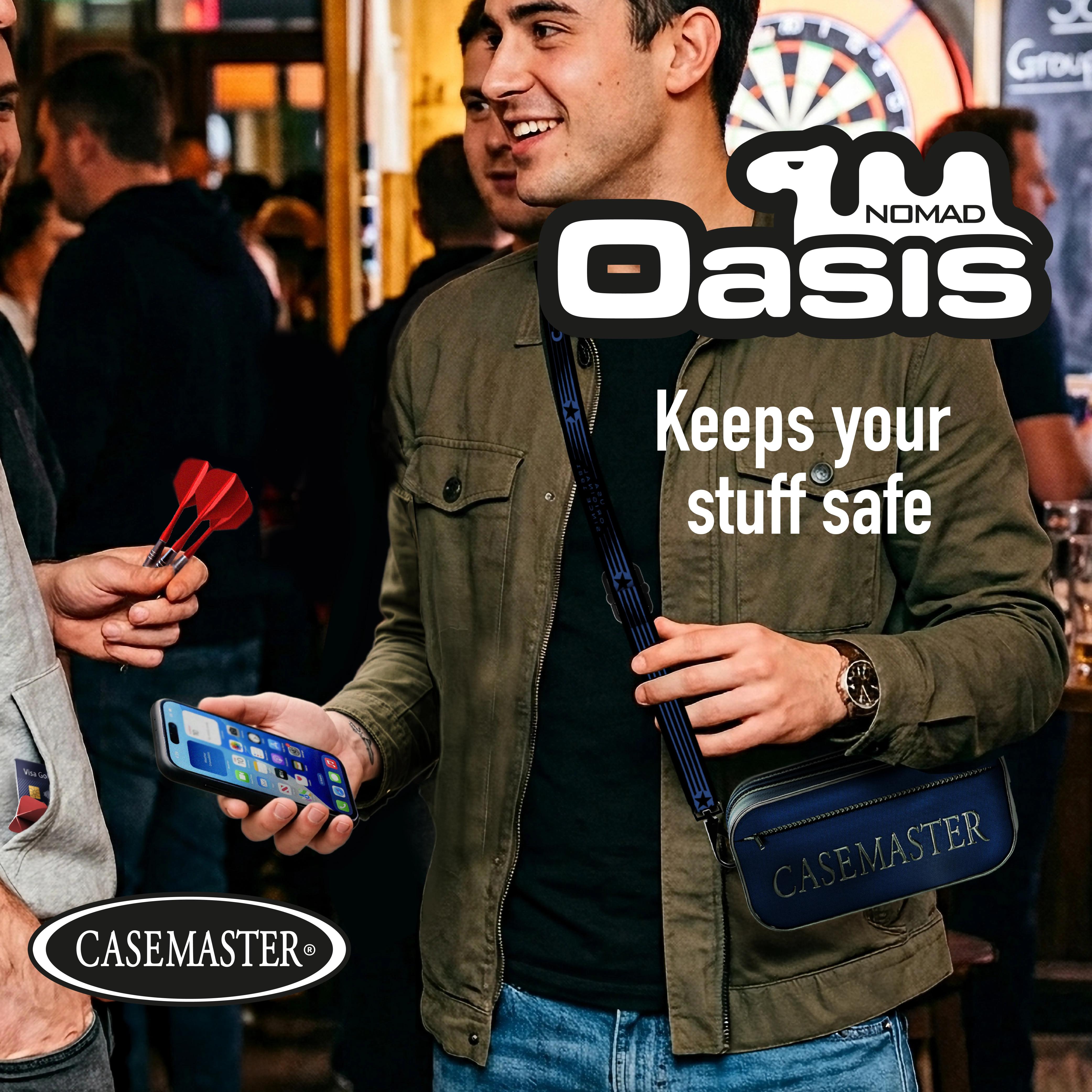 Man at a darts venue holding a phone with a blue Nomad Oasis case worn across his body