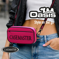 Pink Nomad Oasis dart case worn crossbody at the hip on a shoulder strap