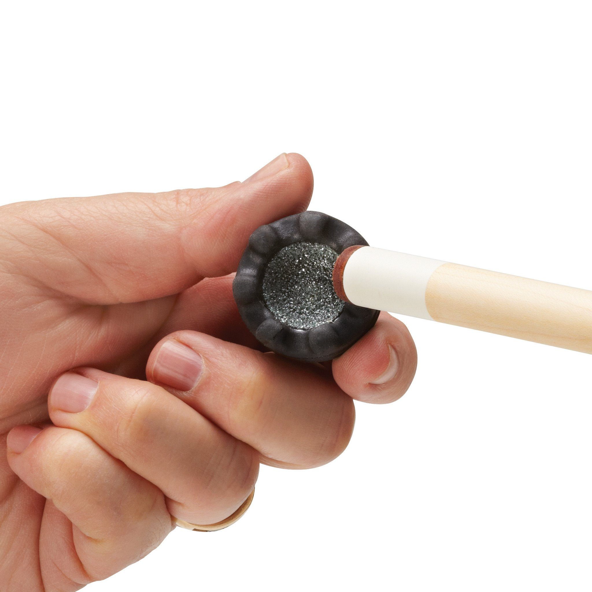 A person holding a cue stick with a black textured tip and natural wood shaft against a white background