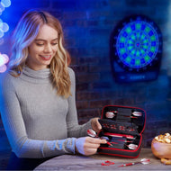 A person holds open a red-trimmed black dart case with darts inside