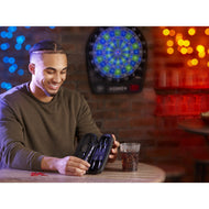 A person holds an open black dart case displaying purple darts at a table