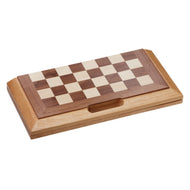 Wooden chess board with dark brown and cream squares on a light wood base with storage compartment