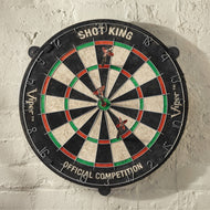 Black dartboard with red and green rings, cream wedges, two darts in center, numbered 1-20 around edge