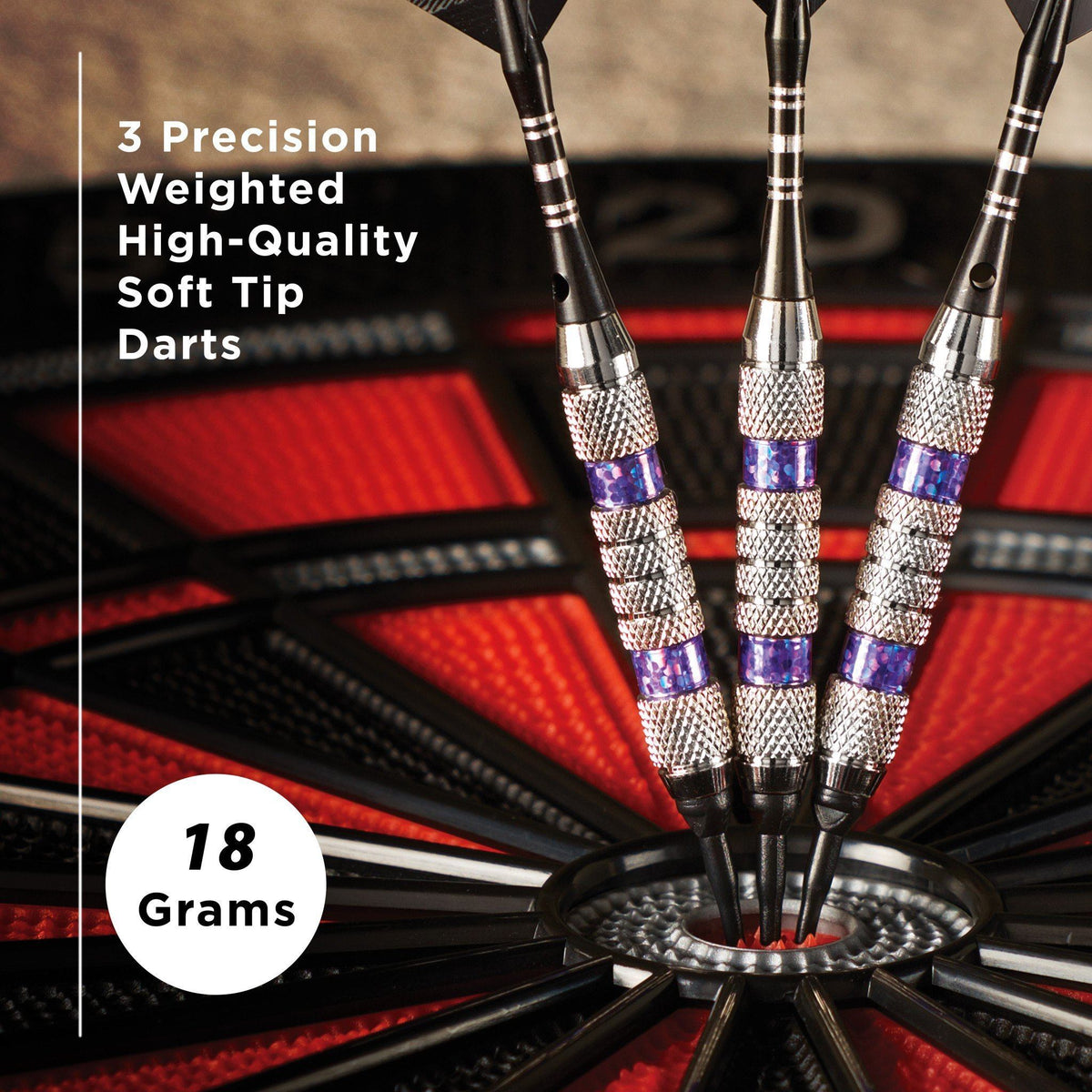 Three black soft tip darts with silver knurled grip and purple band detail, 18 grams, in dartboard socket