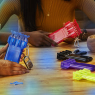 Two people holding open blue and pink dart cases with keychains on a wooden table