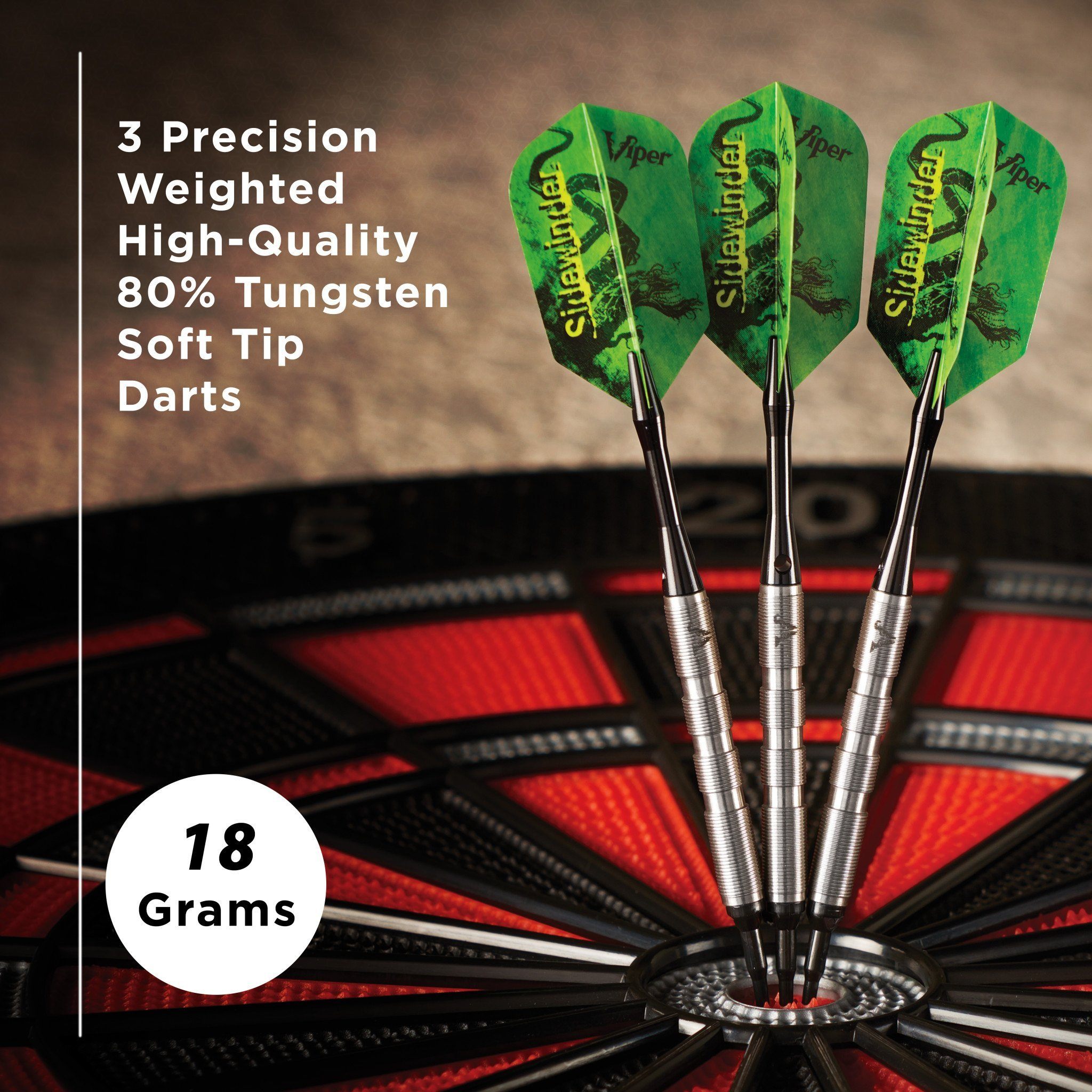 Three soft-tip darts with green flights and metal barrels standing in a dartboard, 18 grams each