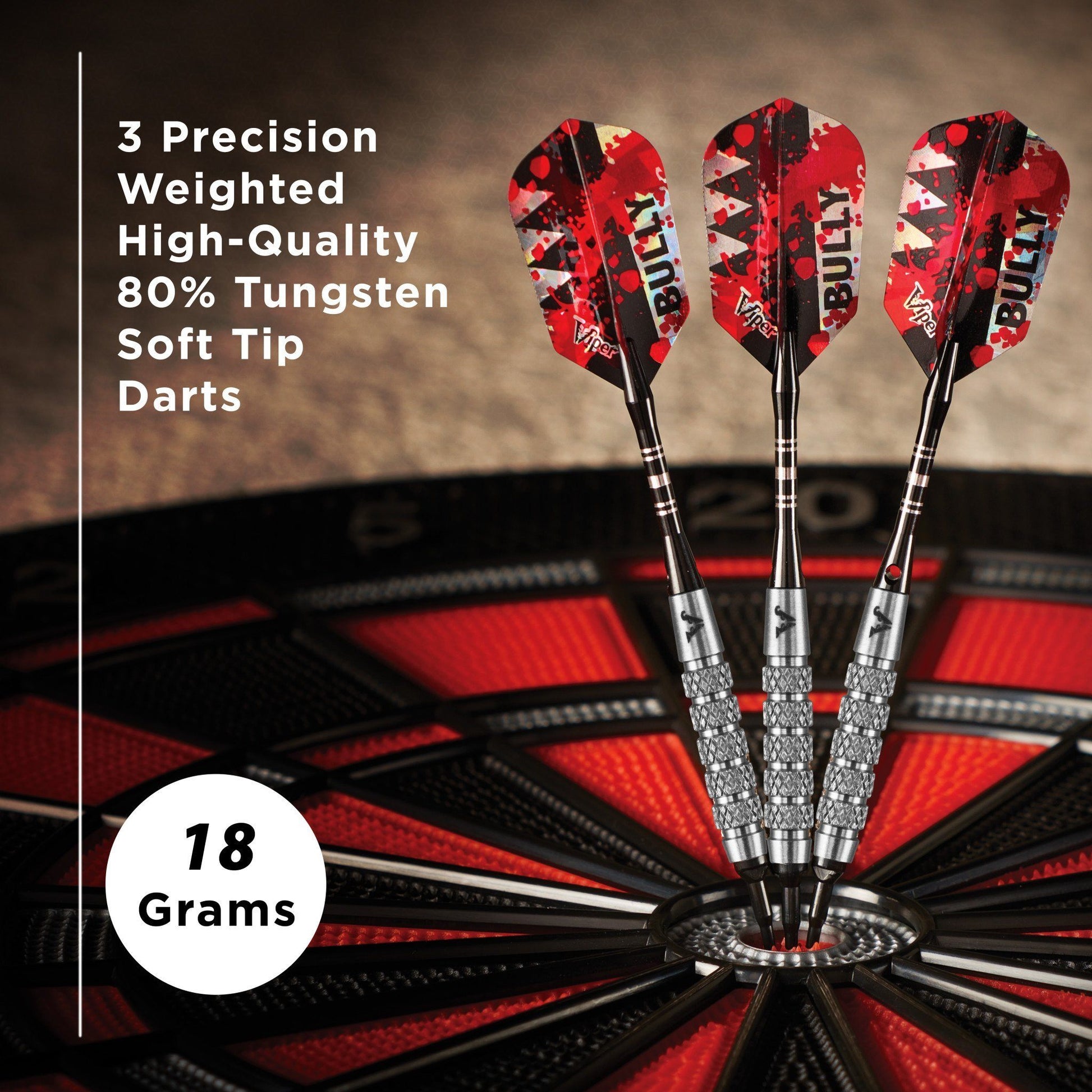 Three red and black soft tip darts with tungsten barrels in a dartboard, 18 grams each