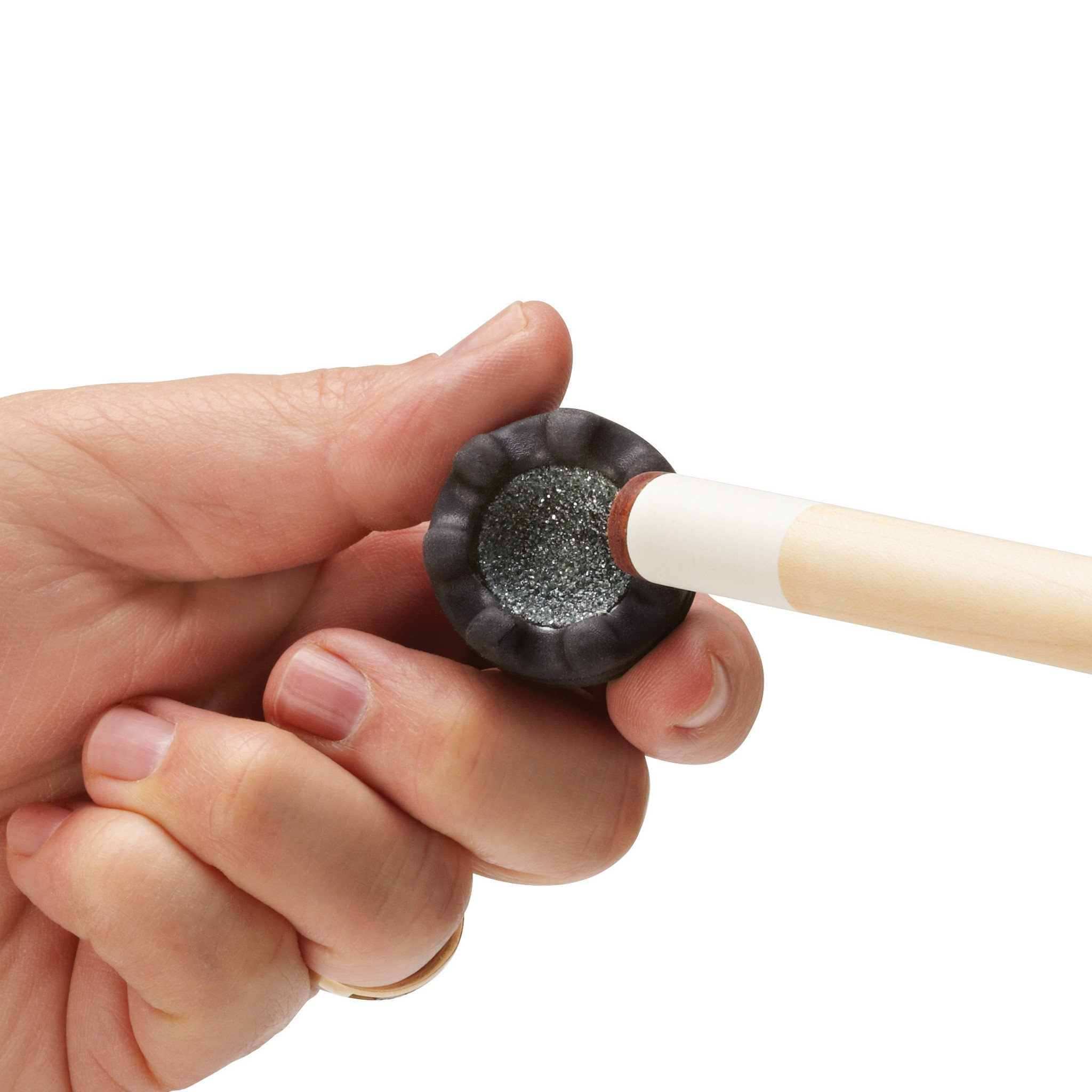 A person holding a cue stick with a black ferrule and gray textured tip against a white background