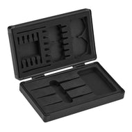 Open black plastic dart case with hinged lid showing foam-lined compartments for darts and accessories