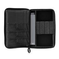 Open black zippered dart case with compartments and gray cylindrical dart tube inside