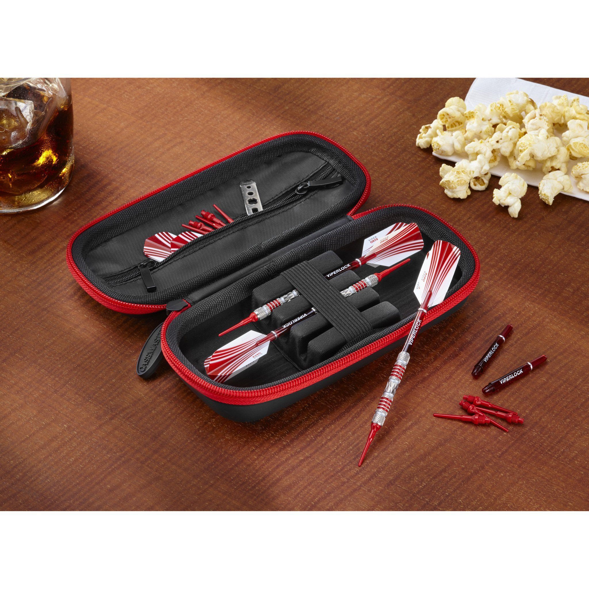 Black and red dart case with red and white striped darts and accessories inside