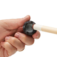 Hand holding wooden cue stick displaying black rubber tip with silver abrasive surface