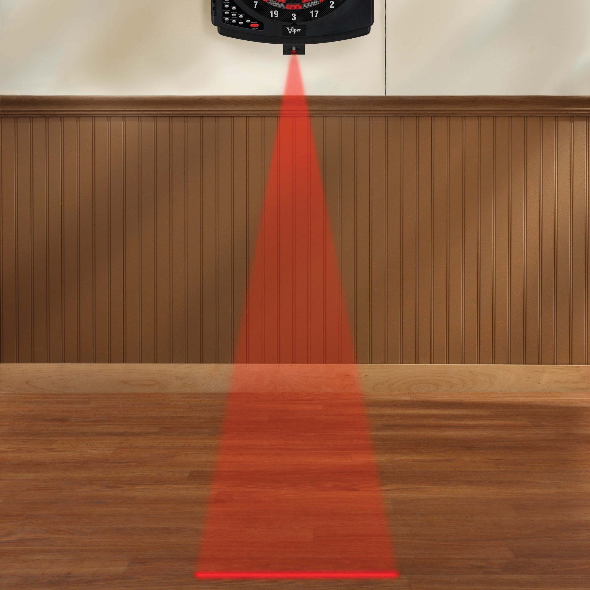 Black Viper dartboard mounted on wall with red laser line projecting downward onto wooden floor