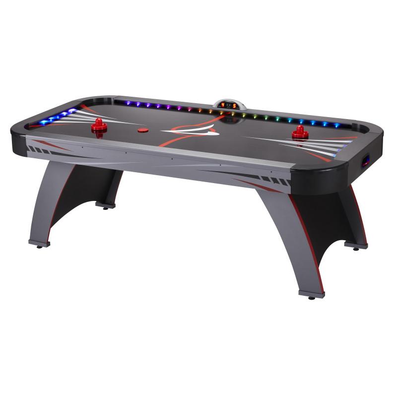 Fat Cat Volt LED air hockey table with gray surface, red strikers, and LED lights along the edges