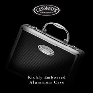 Black aluminum case with silver handle and embossed horizontal ridges, Casemaster logo on front