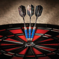 Three darts with blue barrels in a dartboard with red and black segments