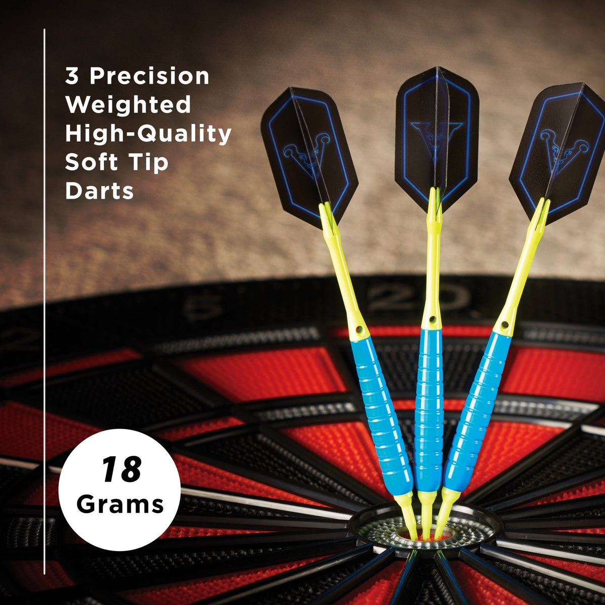 Three soft tip darts with blue-edged black flights and yellow shafts in dartboard