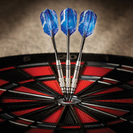 Three blue darts with metal barrels in a dartboard bullseye with red and black segments