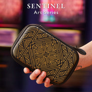 Sentinel Art Series dart case with black exterior and gold geometric triangle pattern held in a person's hand
