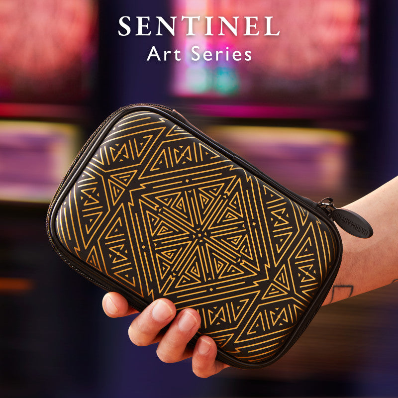 Sentinel Art Series dart case with black exterior and gold geometric triangle pattern held in a person's hand