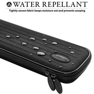 Black cue case with water droplets beading on textured fabric surface and dual zippers at bottom
